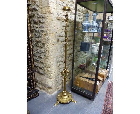 A GOOD ANTIQUE ARTS AND CRAFTS BRASS STANDARD LAMP NOW WITH ELECTRICAL FITTING.