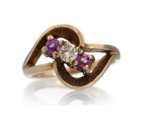 set with a central round brilliant cut diamond of approximately 0.15 carats flanked by pink sapphires, in nine carat gold, si