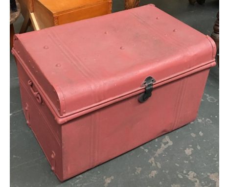 A metal travel trunk with loop handles 
