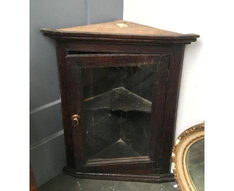 A glazed oak corner cupboard, with single shelf, 71cm high 