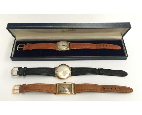 A gent's 9ct gold manual wind pocket watch in H. Samuel box, together with a gent's 18ct gold tank watch, and a Cyma, the bac
