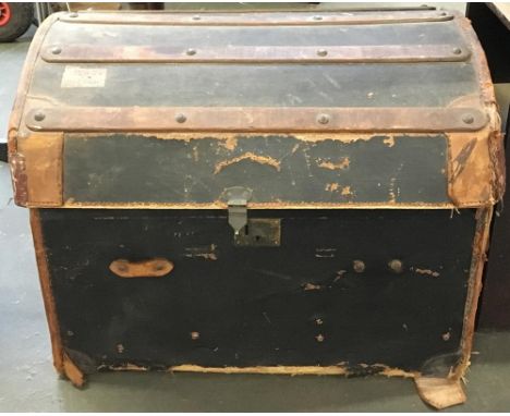 A dome top leather travel trunk 