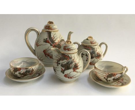 A Japanese fine teaset, to include teapot, milk jug, sugar bowl, and two cups and saucers 