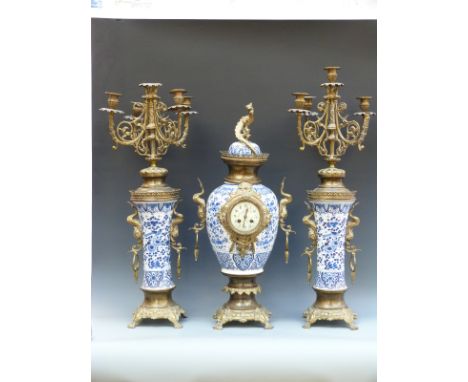 Thieble, 19thC French brass and ceramic clock garniture in the Oriental style of a lidded urn with candelabra either side, do