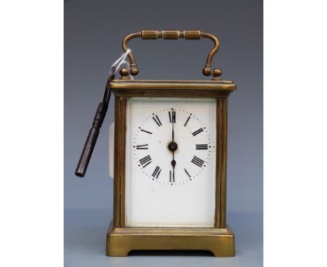 A French late 19thC /early 20thC carriage clock in brass corniche style case. The white enamel Roman dial with blued steel sp