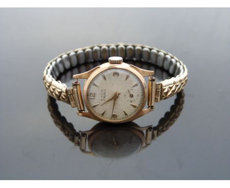 Eton 18ct gold ladies wristwatch with subsidiary seconds dial, gold hands and arrow markers, cream face and Marcus 17 jewel m