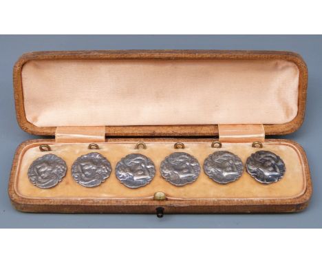 A cased set of Edward VII hallmarked silver buttons of Art Nouveau design depicting a lady playing a harp, B'ham 1902 maker's