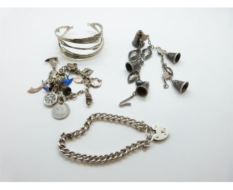 A silver charm bracelet with enamel bird charm, silver mermaid, silver car etc, silver curb link bracelet, Art Nouveau style 