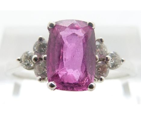 An 18ct white gold ring set with a pink sapphire of approximately 1.74ct and six diamonds, size Q/R, 3.13g  