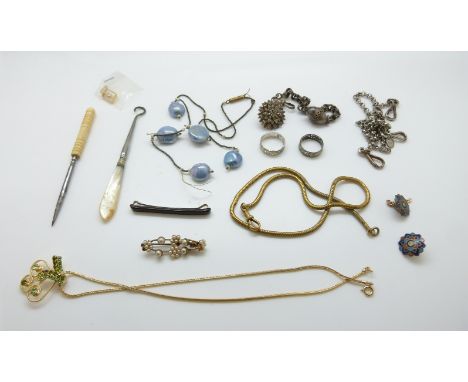A silver bracelet with egg pendant, fob chain, buckle, enamel buttons, filigree rings etc