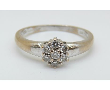 An 18ct white gold ring set with diamonds in a cluster, 2.63g (size N)