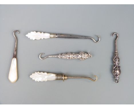 Five various hallmarked silver, mother of pearl and other handled button hooks