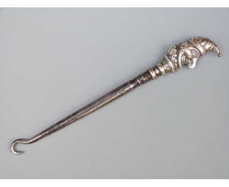 An Edward VII hallmarked silver handled Punch button hook, Birmingham 1906 maker Robert Pringle & Sons, length 15cm