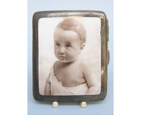 An Edward VII hallmarked silver and pictorial enamel cigarette case, the front decorated with a portrait of a baby, Birmingha
