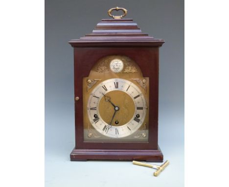 Elliott three-train shelf/bracket style clock in dark wood-stained case. The brass dial with silvered Roman chapter ring, che