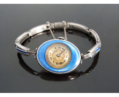 Gruen Watch Co silver ladies wristwatch with black Roman numerals, engraved gold face, blue guilloché enamel set case and sig