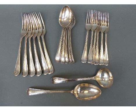 A quantity of silver plated cutlery comprising six table forks, six dessert forks, five dessert spoons, serving spoon and a l