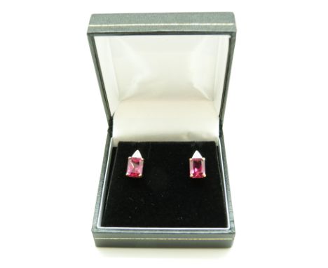 A pair of 9ct gold earrings set with a synthetic ruby and diamonds to each
