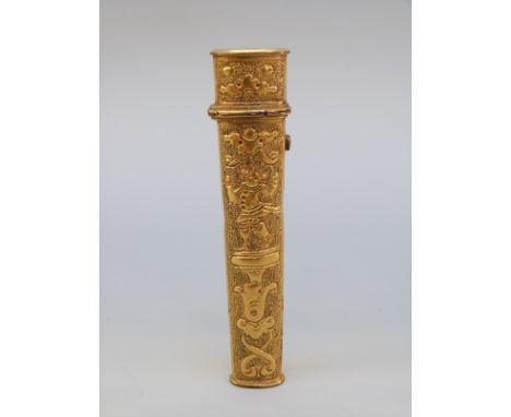 An 18thC gilt metal bodkin case with relief decoration of a jester or acrobat on a pedestal, length 8cm 