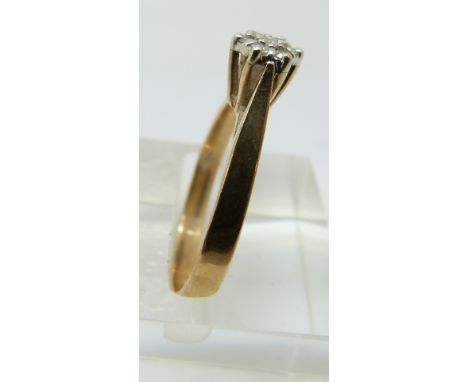 A 9ct gold ring set with diamonds in a cluster, 2.25g (size P) 