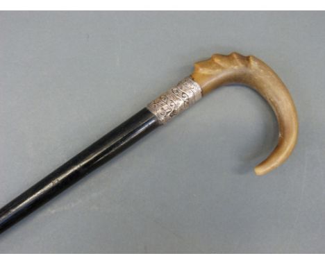 An Edwardian hallmarked silver and rhinoceros horn walking stick