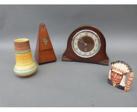 A mahogany metronome, mantel clock, shelley vase and a Royal Doulton character jug of a North American D6614