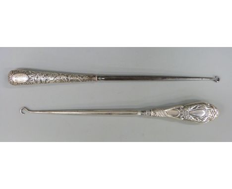 Two long hallmarked silver handled button hooks, length of longest 30cm