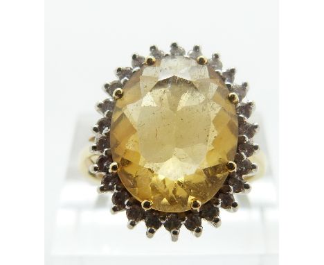 An 18ct gold ring set with a citrine and diamonds, size Q/R, 8.27g 