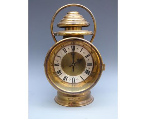 Thomas Harrington and Sons brass signalling lamp, fitted with a German battery operated quartz clock movement with Roman dial