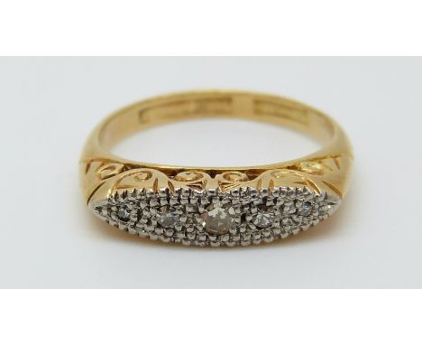 An 18ct gold ring set with diamonds in a platinum setting, 3.04g (size J)