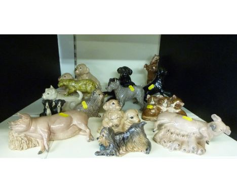 A large collection of Heredities ceramic animal figures including dogs, cats, pigs etc