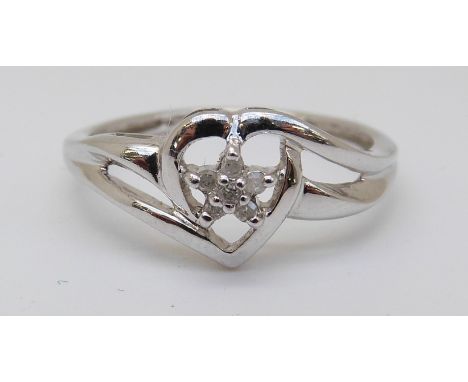 A 9ct white gold ring set with diamonds in a heart shaped setting, 1.75g (size N) 