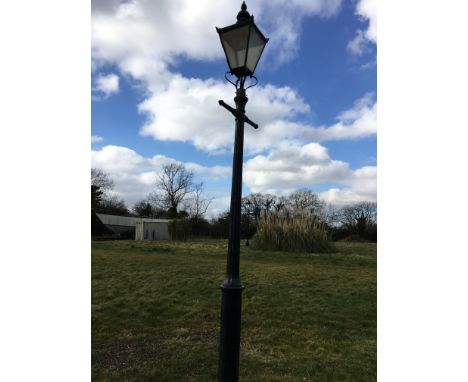 A cast iron Victorian/Victorian style street lamp converted to electricity with T Spittle, Newport to base