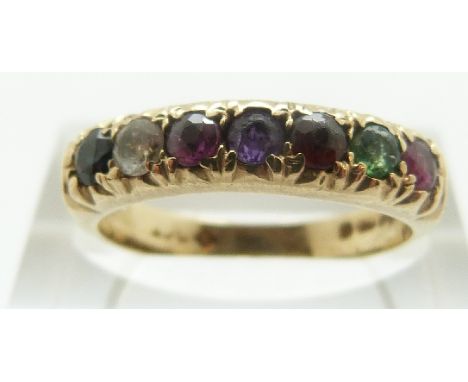 A 9ct gold ring set with seven gemstones spelling out 'regards' (ruby, emerald, garnet, amethyst, ruby, diamanté, sapphire) s