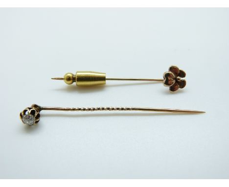 A late Victorian stick pin set with a round cut diamond (0.25ct) and a 9ct gold stick pin, 2.4g 