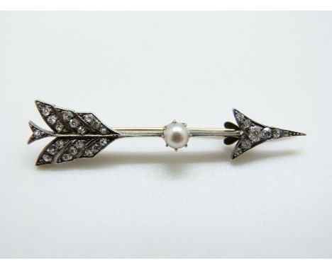A Victorian brooch set with old cut diamonds and a pearl in the form of an arrow