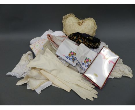 An embroidered hat and a quantity of further textiles, lace etc 