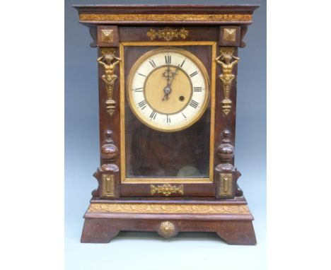 Continental late 19thC single train mahogany mantel clock, the Roman dial with beetle style hands, the anonymous pressed bras