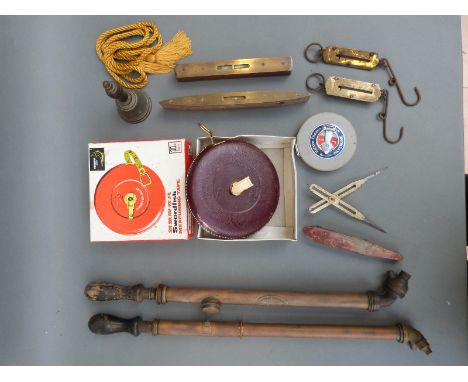 A quantity of tools including spring balances, measuring tapes, sprayers etc