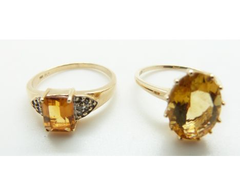 A 9ct gold ring set with an oval citrine and a 9ct gold ring set with a citrine and diamonds, size R/S and T, 7.11g 