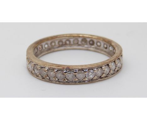 A 9ct gold eternity ring set with diamonds (size N) 