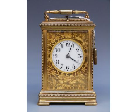 A French c1900 brass cased repeater carriage clock with beaded decoration to case and floral and foliate decoration to dial s