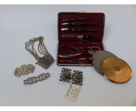 A collection of items to include Zwilling, JA Henckels, Germany manicure set, silver necklace, silver buckle, compact etc