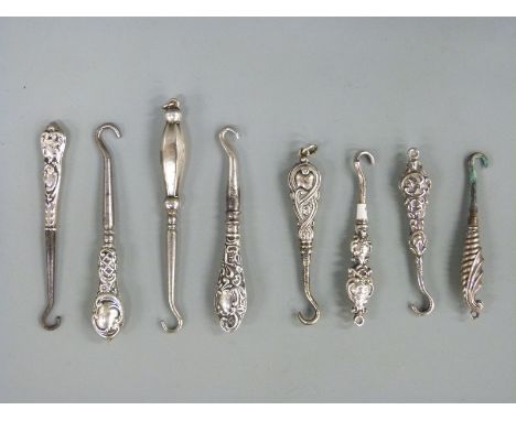 Eight various small hallmarked silver handled button hooks