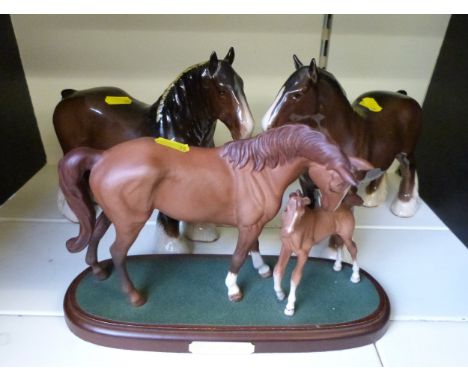 Two Beswick standing Shire horses and a Royal Doulton 'First Born' figure