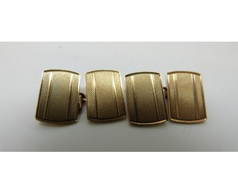 A pair of 9ct gold cufflinks with engine turned design, 7g