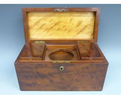 A mahogany tea caddy with Bramah type lock, the lid opening to reveal twin caddies and space for a mixing bowl to centre, wid