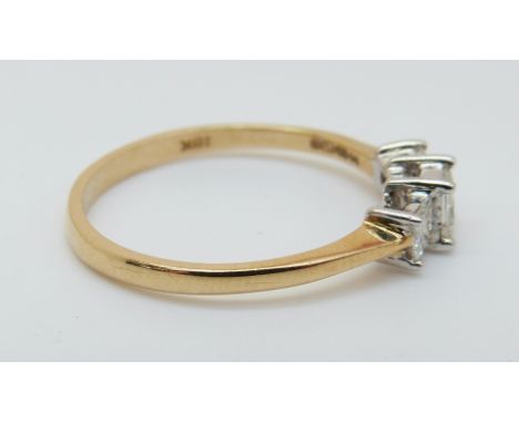 An 18ct gold ring set with three princess cut diamonds totalling approximately 0.5ct (size O) 