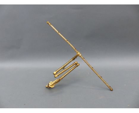 A brass articulated tapestry / fire screen frame