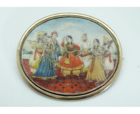 A miniature portrait brooch hand painted with an Indian dancing scene, inscribed to the reverse 'Sir W. Scott, Col. 15th KH, 